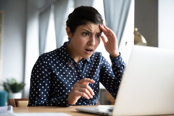 Shocked looking person at a laptop